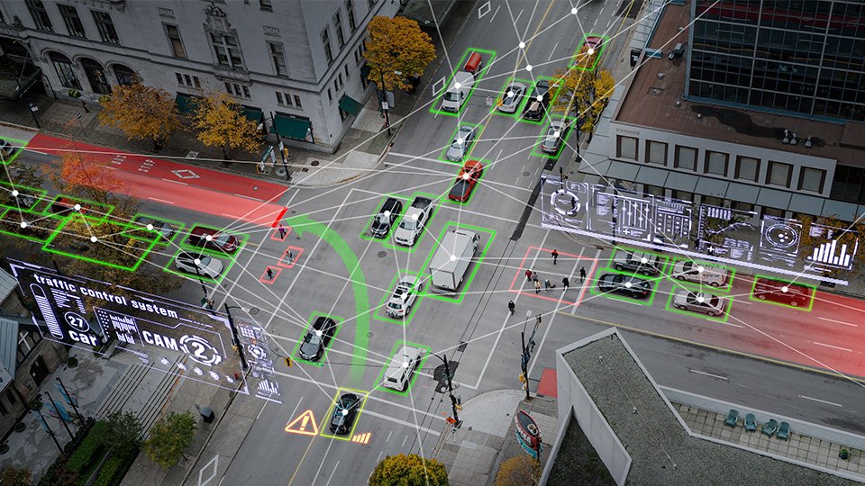 A imagem mostra um cruzamento movimentado, com marcações de Inteligência artificial denotando a direção do fluxo de cada veículo, assim como cada veículo na imagem.